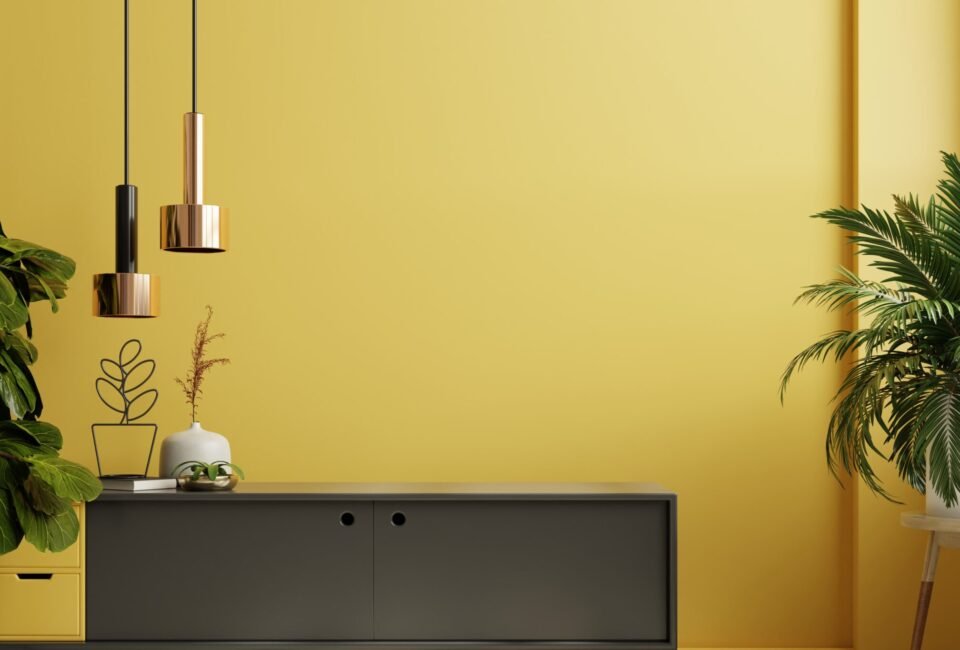 Minimalist interior background with black cabinet and yellow wall.